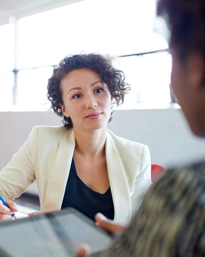 Woman interviewing employee during exit interview